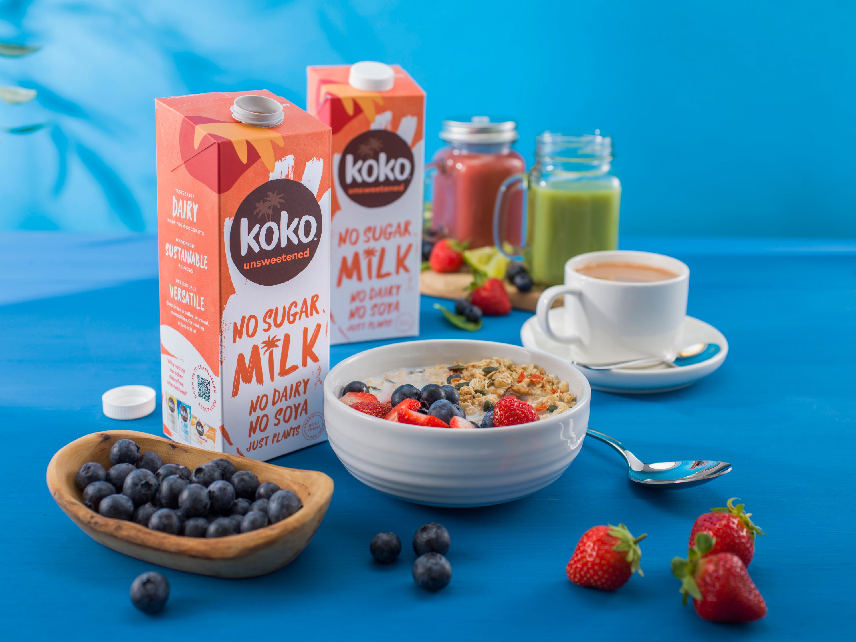 Koko Unsweetened UHT milk with breakfast setup and lid off.