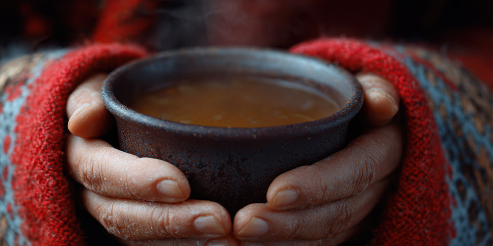 cup of beefy bovril being held in hands