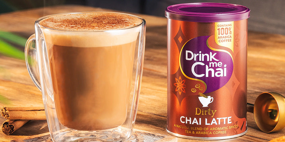 dirty chai latte powder tin next to cup