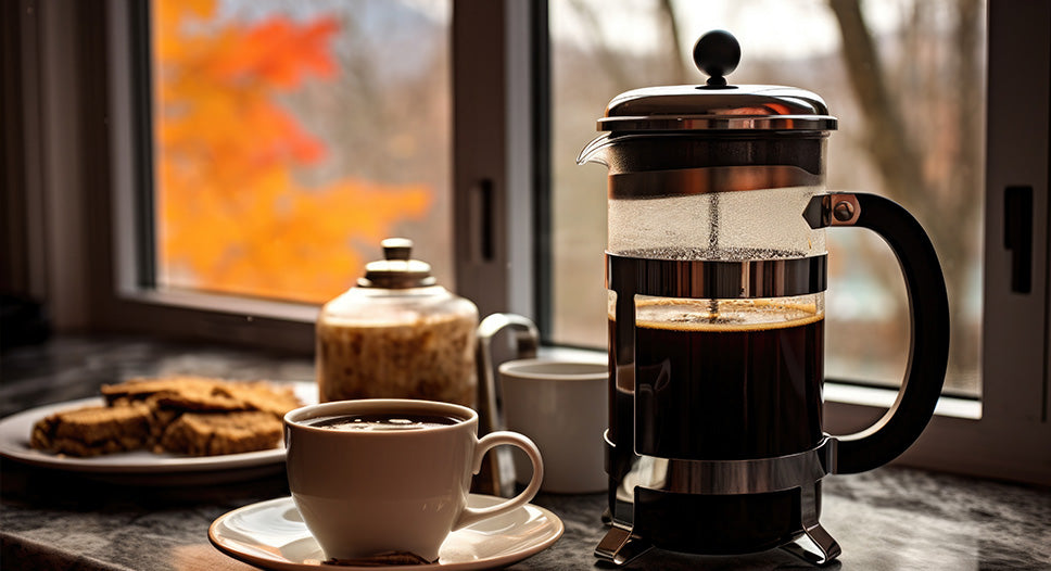 french press cafetiere coffee in coffee shop with americano and plate of cookies