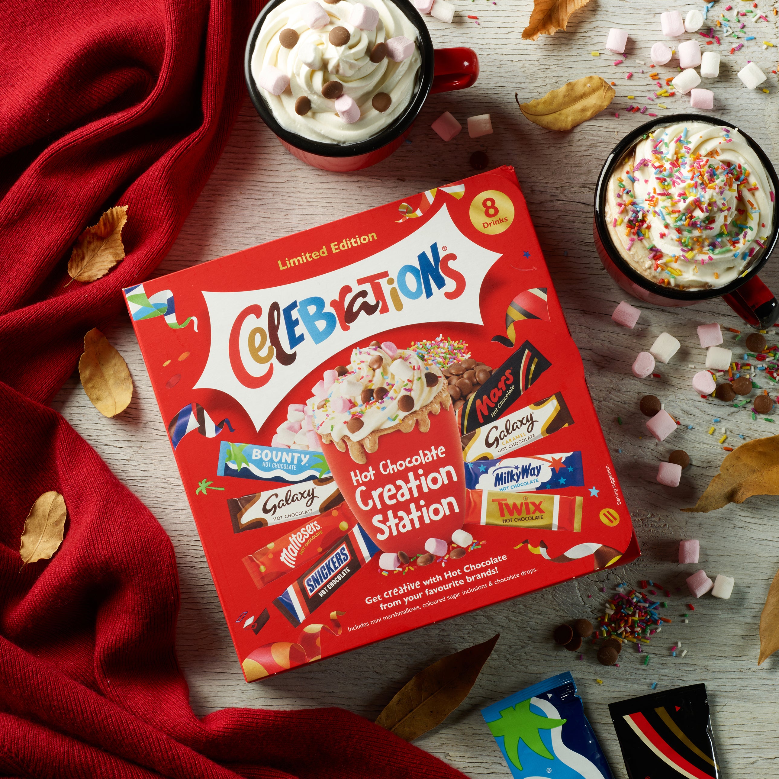 A cozy winter-themed lifestyle shot of a Celebrations hot chocolate station
